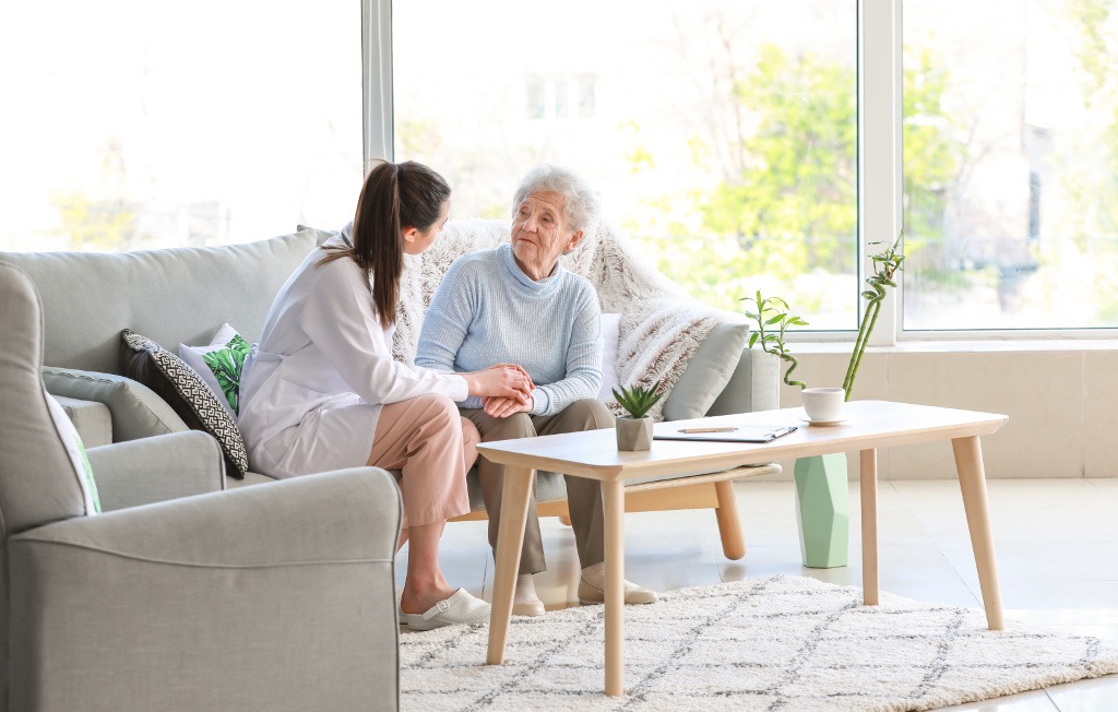 BLH care specialist speaking with a community member at home